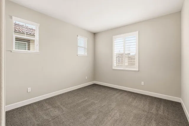 a white toilet sitting next to a bath tub