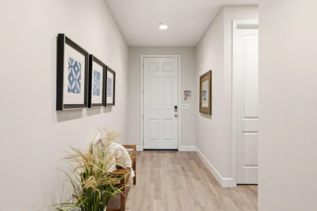 a view of entryway with wooden floor