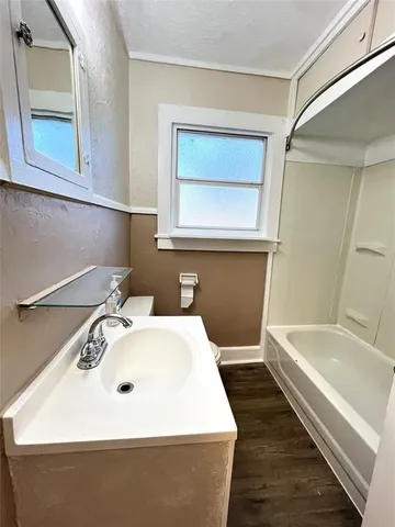 a bathroom with a sink and a bathtub