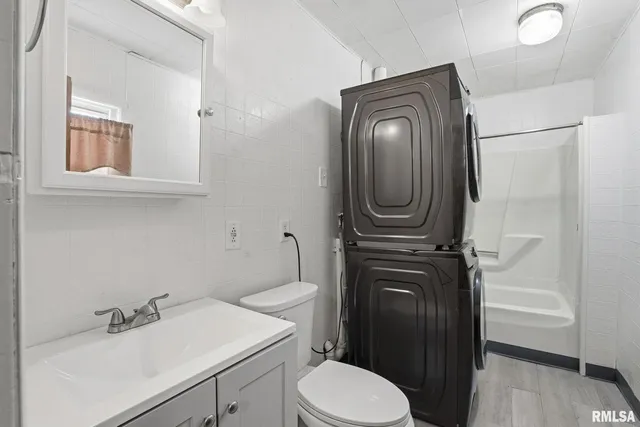 a bathroom with a toilet a sink and a mirror