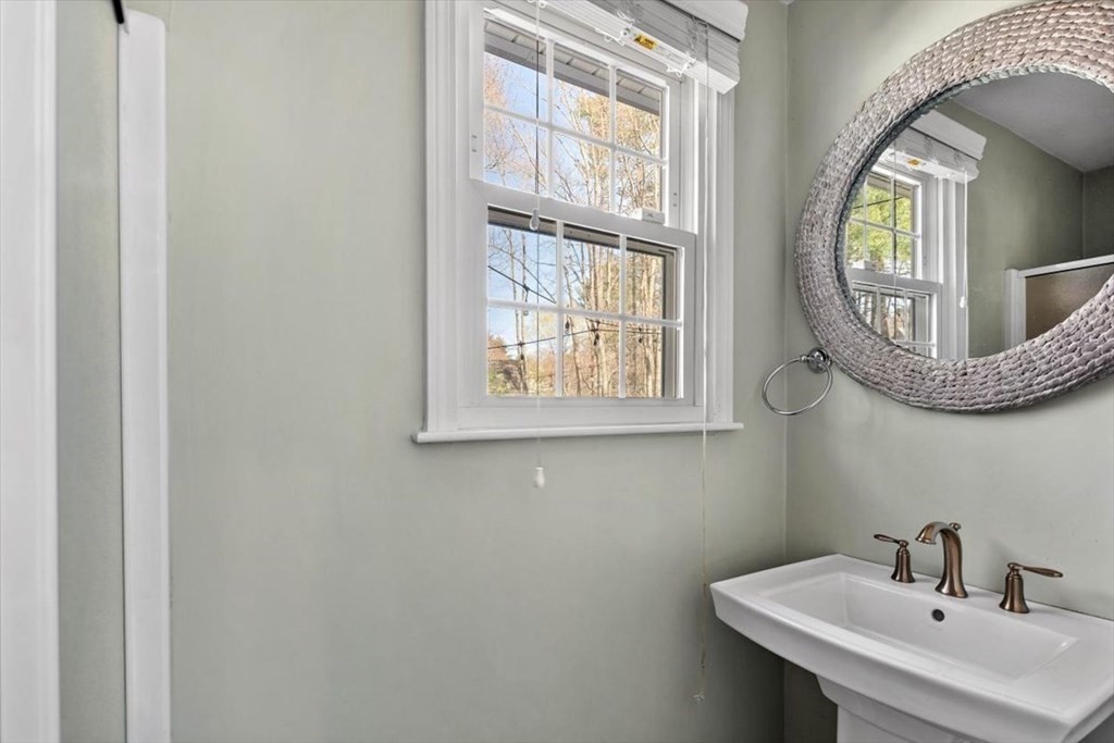 26 Stanford Drive Hingham, MA 02043 - Photo 15 of 37 a bathroom with a sink and a mirror