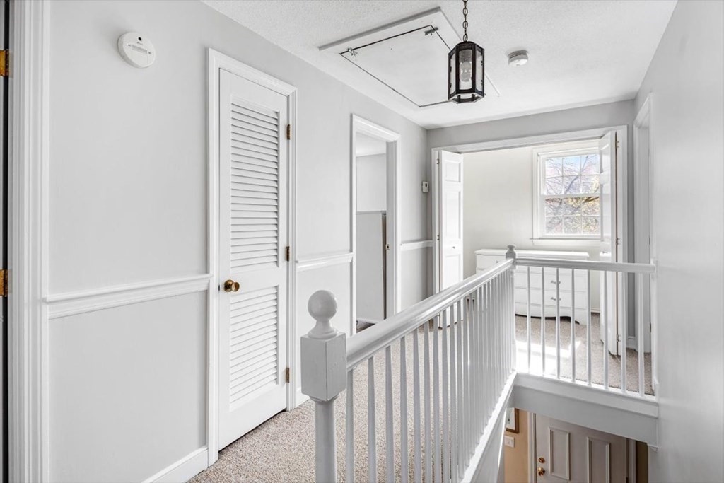 26 Stanford Drive Hingham, MA 02043 - Photo 19 of 37 a view of a hallway with windows and stairs
