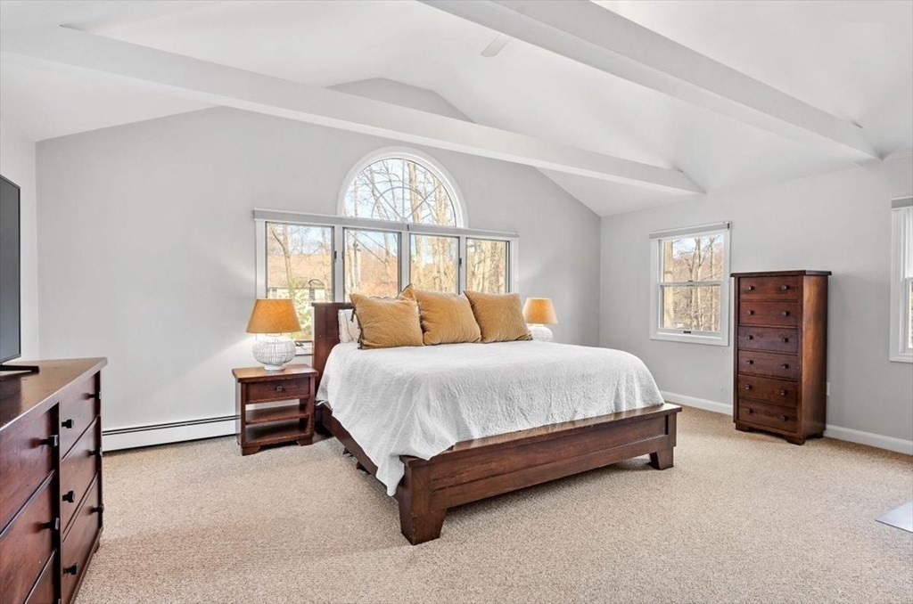 26 Stanford Drive Hingham, MA 02043 - Photo 20 of 37 a spacious bedroom with a bed and a large window