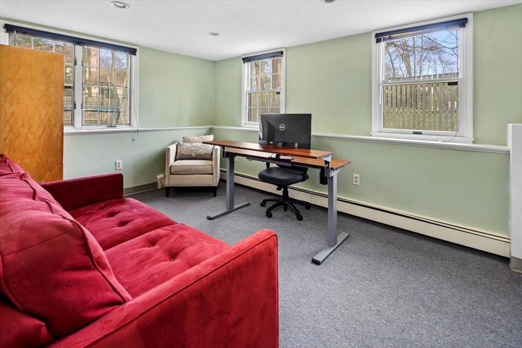 26 Stanford Drive Hingham, MA 02043 - Photo 29 of 37 a living room with furniture and a flat screen tv