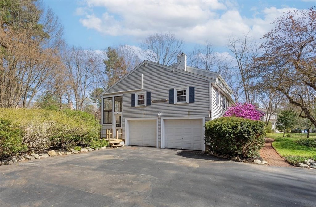 26 Stanford Drive Hingham, MA 02043 - Photo 30 of 37 a front view of a house with a yard and garage