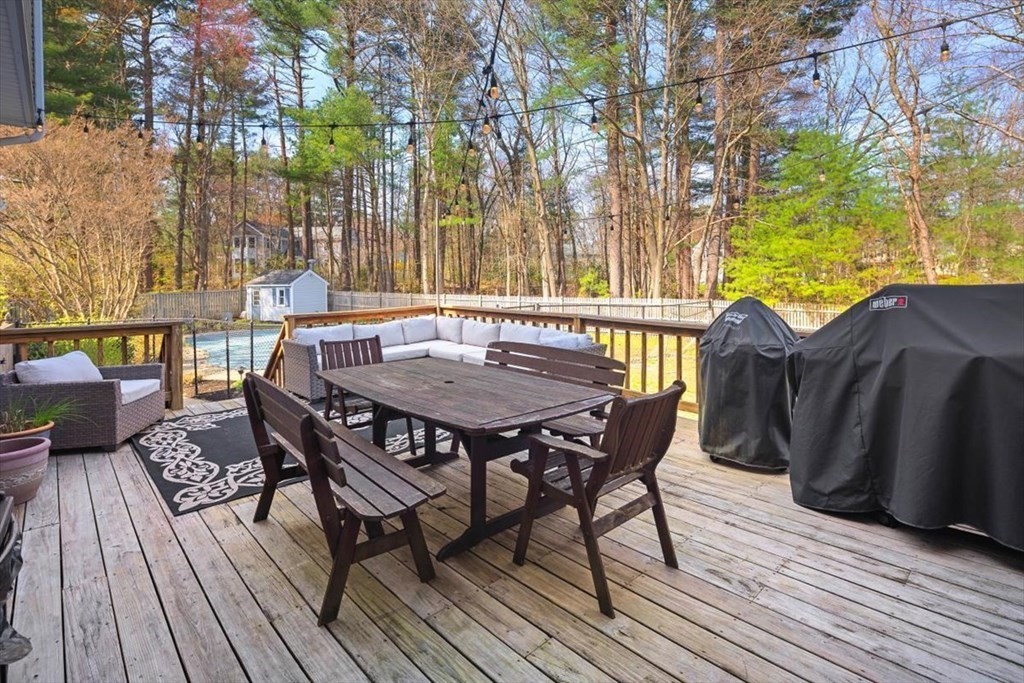 26 Stanford Drive Hingham, MA 02043 - Photo 31 of 37 a view of a dinning table and chairs on deck with wooden floor
