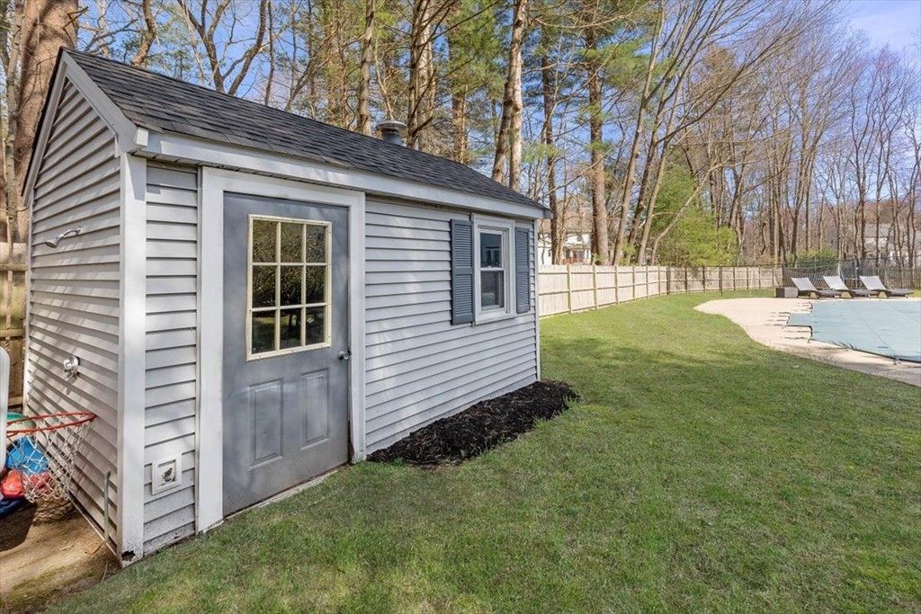 26 Stanford Drive Hingham, MA 02043 - Photo 35 of 37 a view of a backyard with a large tree