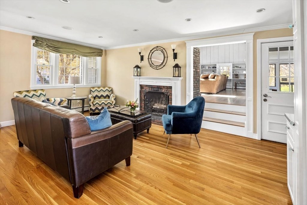 26 Stanford Drive Hingham, MA 02043 - Photo 6 of 37 a living room with furniture and a fireplace