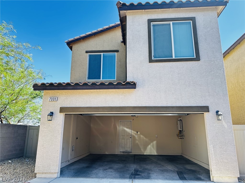 7331 Sunray Point Street North Las Vegas, NV 89084 - Photo 17 of 20 A modern two-story home with a stucco exterior and a tiled roof awaits new owners.