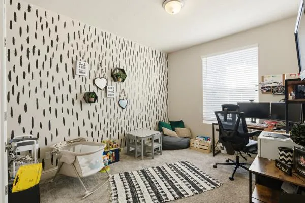 a bedroom with a bed and a fireplace