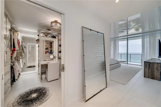 a bathroom with a double vanity sink a mirror and shower