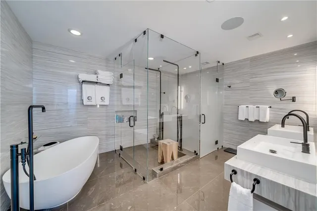 a living room with furniture and large windows