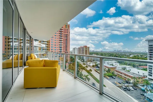 a bedroom with a bed and chandelier