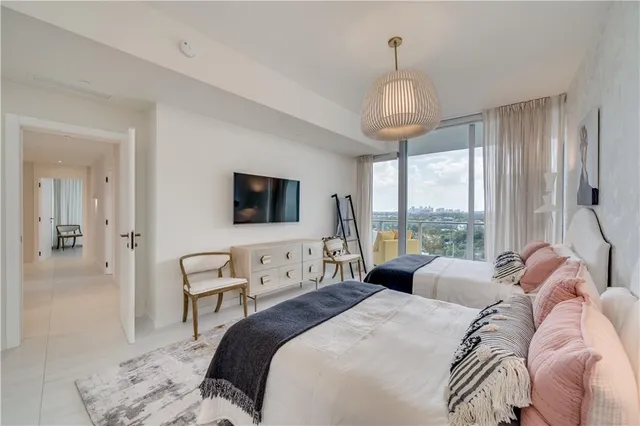 a view of a room with a table and chairs