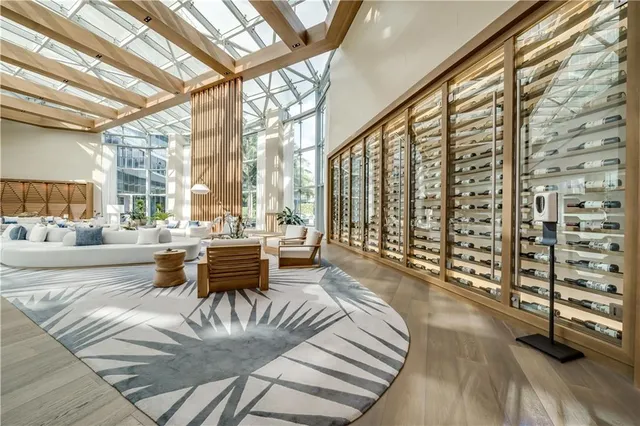 a very nice looking room with a large window and dining table