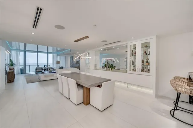 a open kitchen with stainless steel appliances granite countertop a stove and a refrigerator