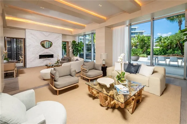 a lobby with furniture and a rug