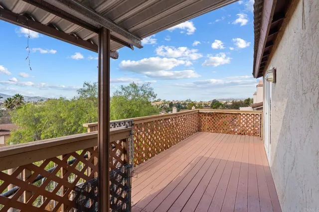 a view of balcony with wooden floor