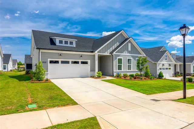 a view of a swimming pool with a yard