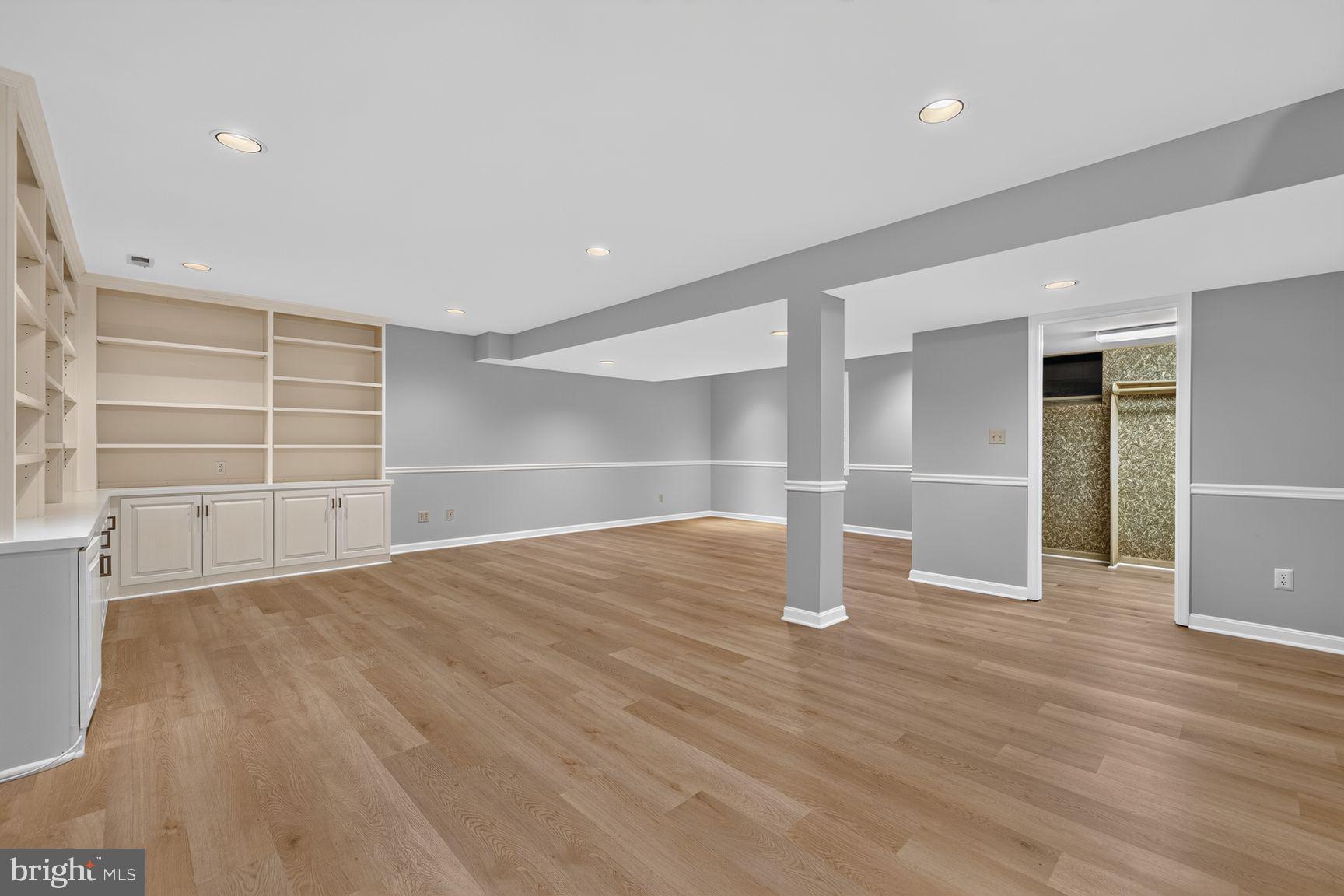 10 Treworthy Road Gaithersburg, MD 20878 - Photo 21 of 30 Lower Level Living Area w/ Built-ins