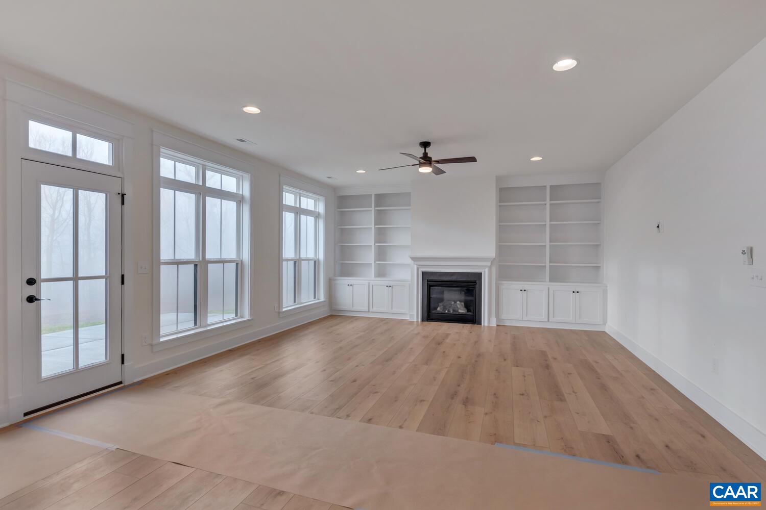 3031 Eagle View Charlottesville, VA 22903 - Photo 16 of 75 an empty room with windows and fireplace