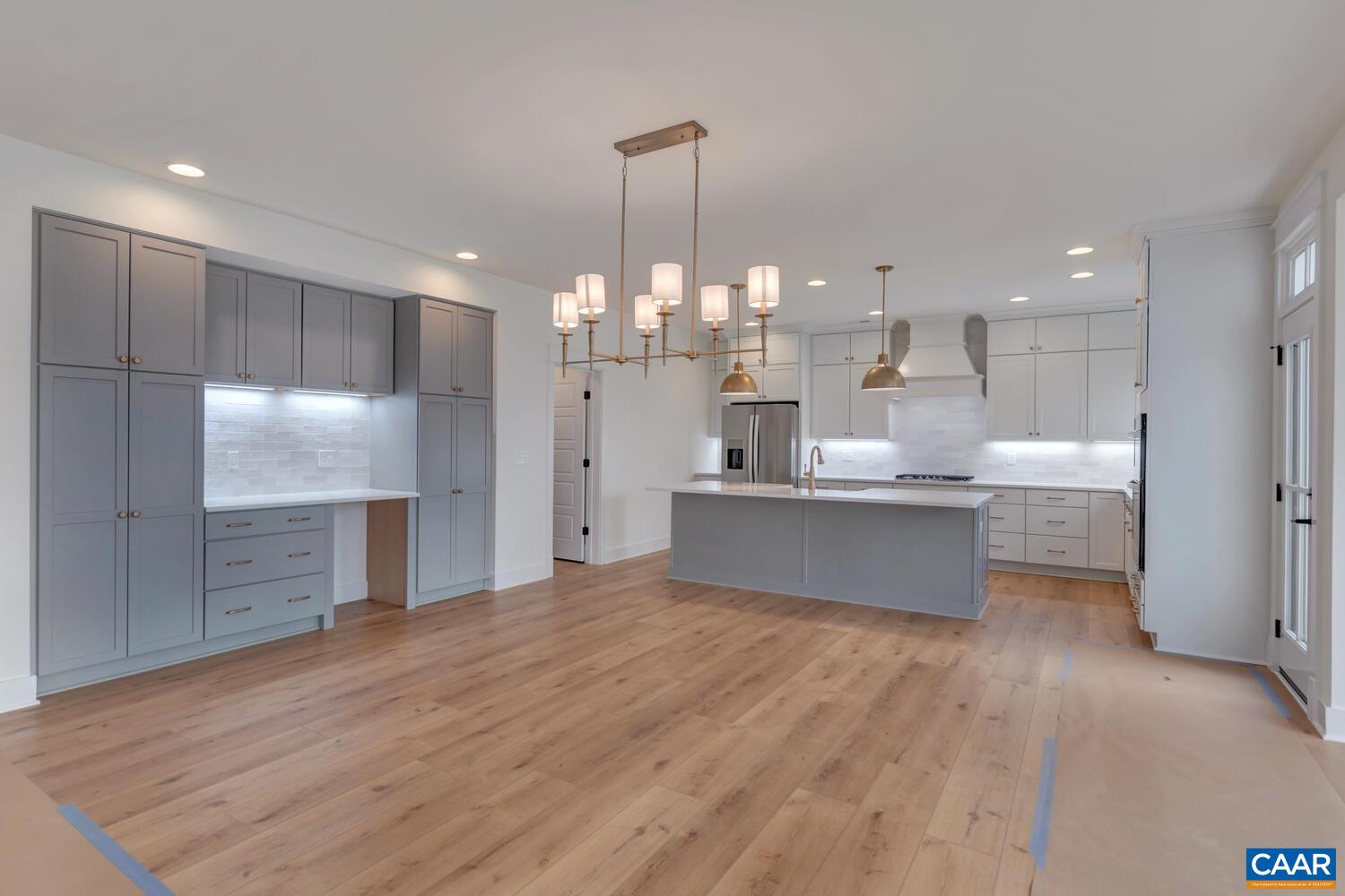 3031 Eagle View Charlottesville, VA 22903 - Photo 21 of 75 a large kitchen with kitchen island a large counter top stainless steel appliances and cabinets