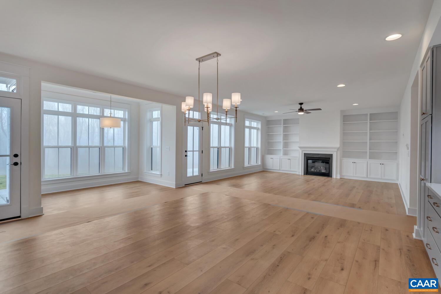 3031 Eagle View Charlottesville, VA 22903 - Photo 22 of 75 an empty room with fireplace and windows