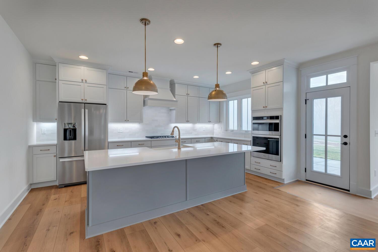 3031 Eagle View Charlottesville, VA 22903 - Photo 28 of 75 a kitchen with stainless steel appliances granite countertop a refrigerator a sink and a stove