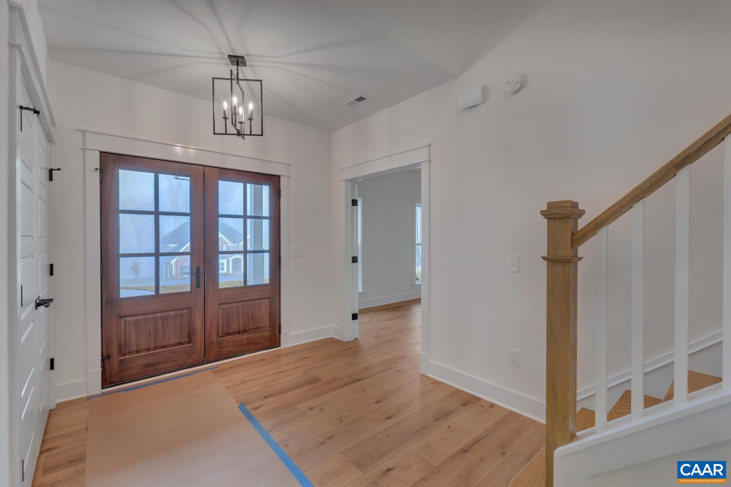 3031 Eagle View Charlottesville, VA 22903 - Photo 3 of 75 wooden floor with chandelier and entryway