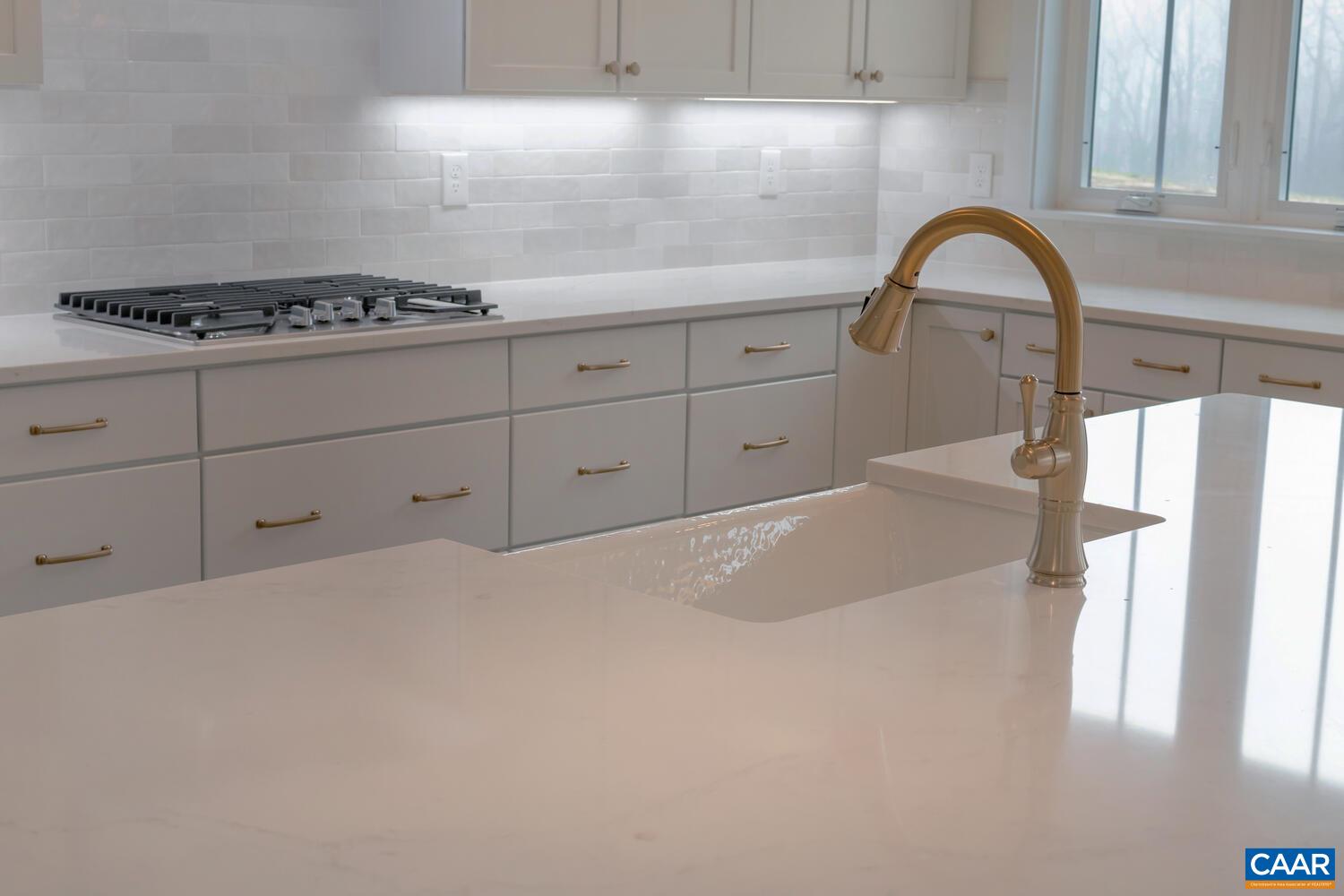 3031 Eagle View Charlottesville, VA 22903 - Photo 68 of 75 a kitchen with granite countertop a stove and a sink