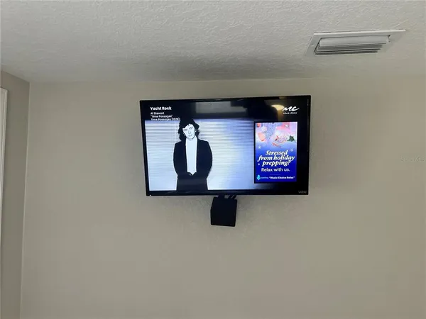 a bathroom with a shower and toilet