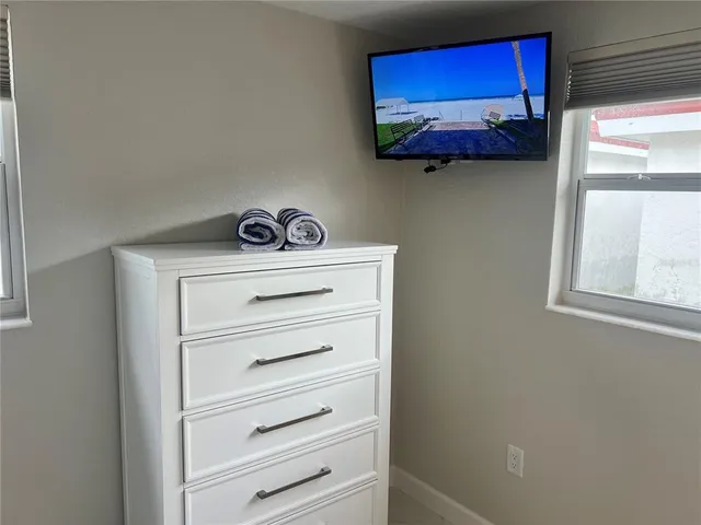a bathroom with a granite countertop toilet and a sink