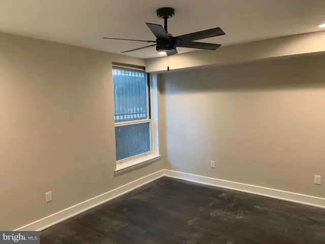 a view of room with a ceiling fan