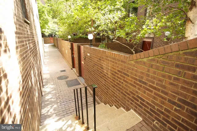 a view of balcony with wooden floor and trees