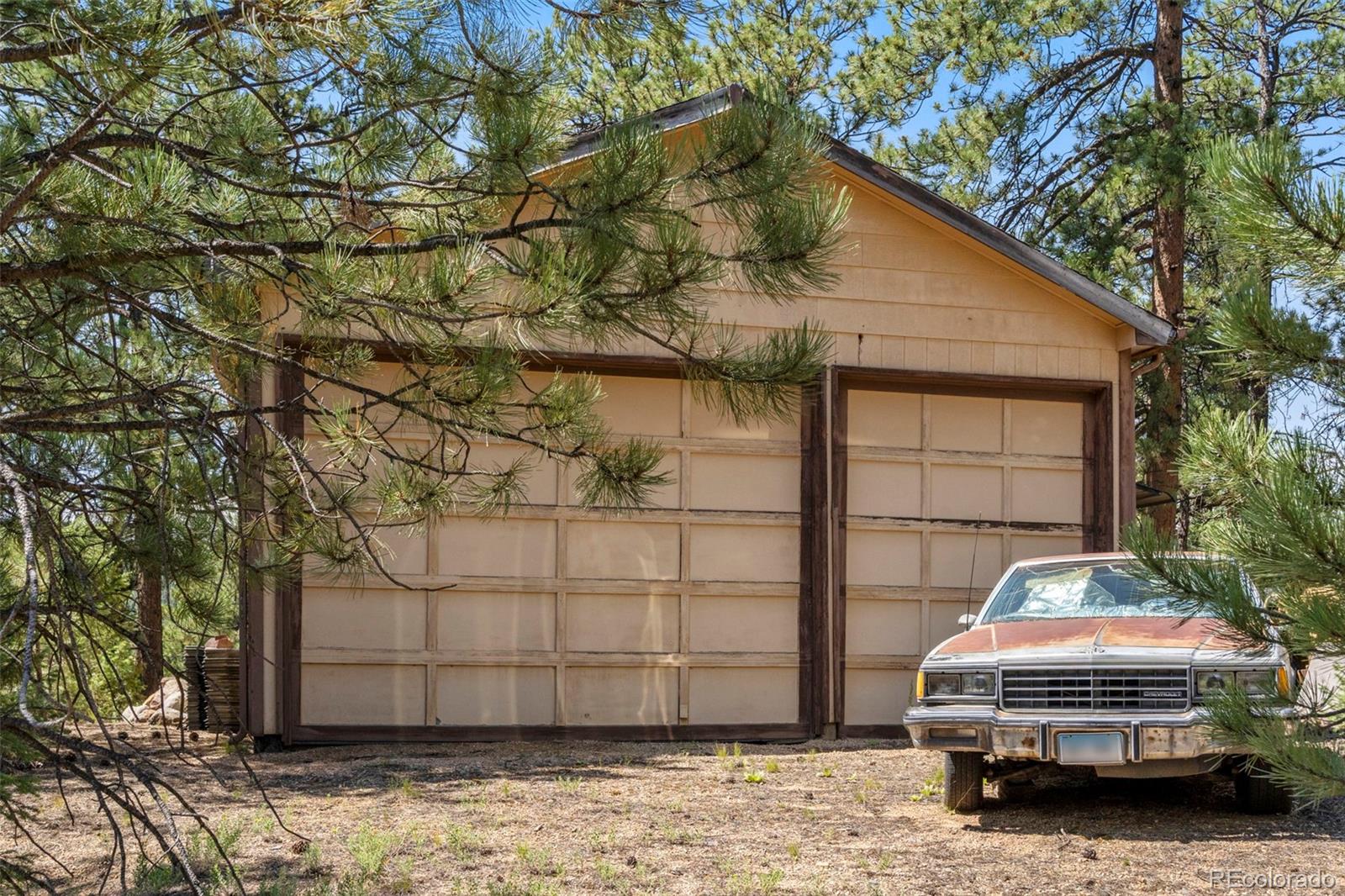 12511 West Tina Lane Sedalia, CO 80135 - Photo 2 of 22 a car parked in front of a house