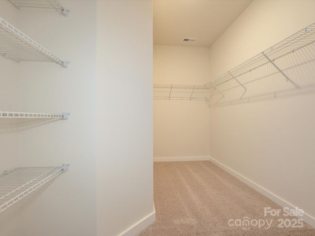 a view of a room with racks on the wall