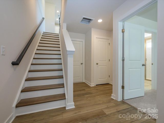 a view of entryway with wooden floor
