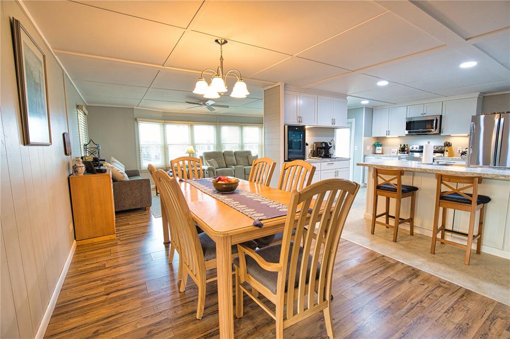 674 El Tango North Port, FL 34287 - Photo 19 of 85 a view of a dining area with furniture window and wooden floor