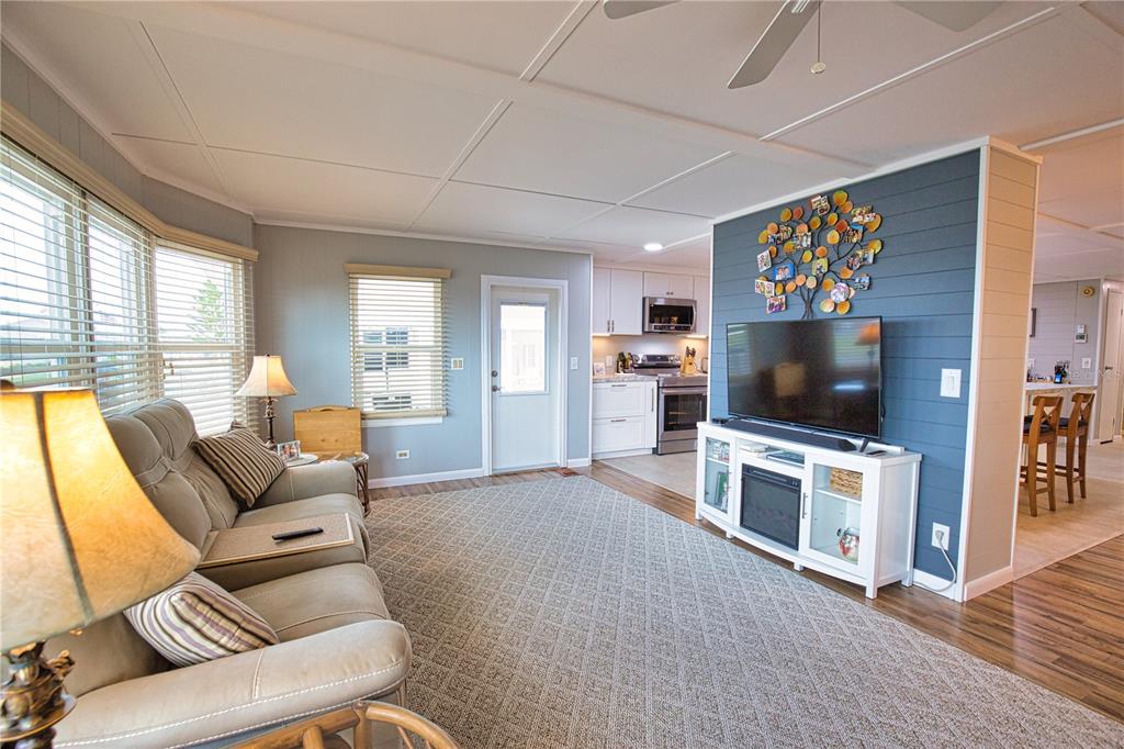 674 El Tango North Port, FL 34287 - Photo 23 of 85 a living room with furniture and a flat screen tv