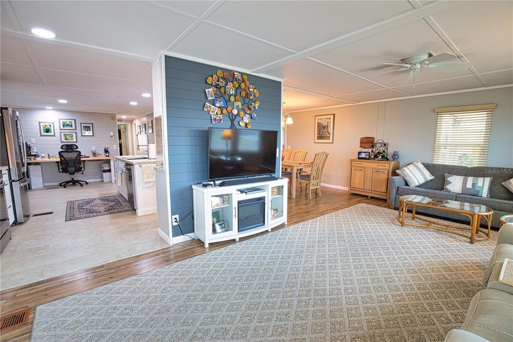 674 El Tango North Port, FL 34287 - Photo 25 of 85 a living room with furniture and a flat screen tv