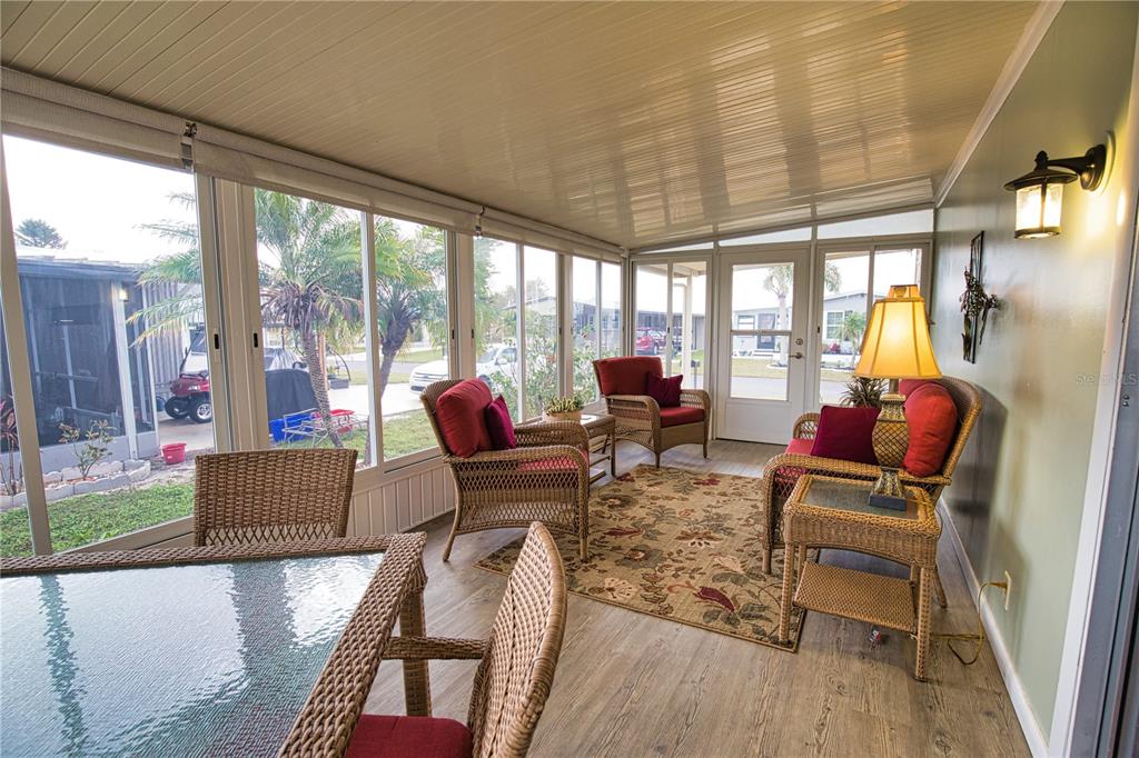 674 El Tango North Port, FL 34287 - Photo 26 of 85 a living room with furniture and floor to ceiling windows