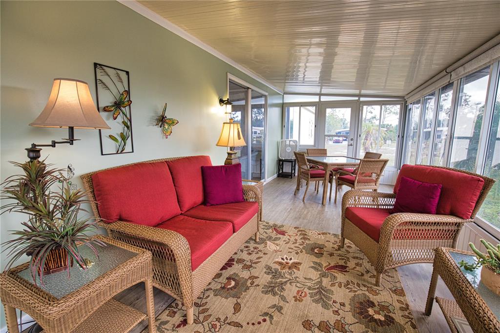 674 El Tango North Port, FL 34287 - Photo 30 of 85 a living room with furniture and a large window