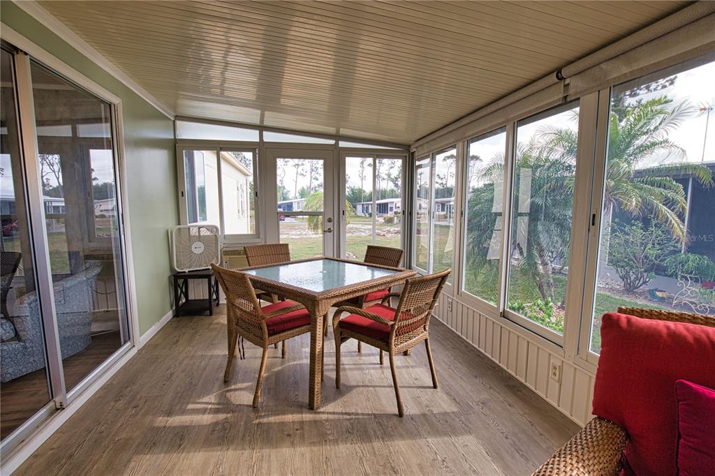 674 El Tango North Port, FL 34287 - Photo 31 of 85 a dining room with furniture window and wooden floor