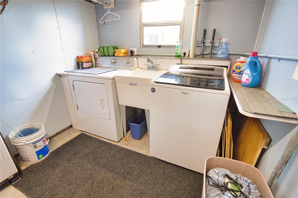 674 El Tango North Port, FL 34287 - Photo 39 of 85 a utility room with sink dryer and washer