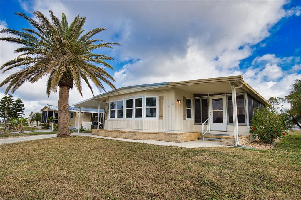 674 El Tango North Port, FL 34287 - Photo 40 of 85 a front view of a house with a yard