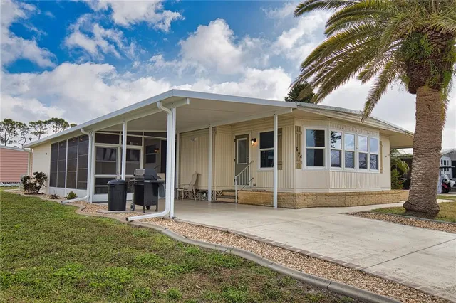 a living room with lots of furniture and a large window