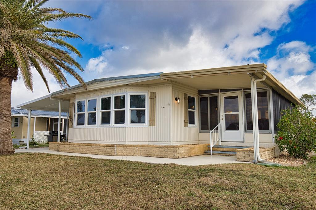674 El Tango North Port, FL 34287 - Photo 45 of 85 a front view of a house with a yard