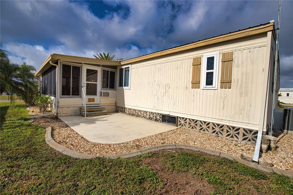 674 El Tango North Port, FL 34287 - Photo 48 of 85 a view of a house with backyard and sitting area
