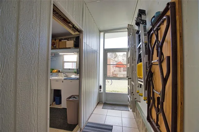 a large kitchen with granite countertop a large counter top stainless steel appliances and cabinets