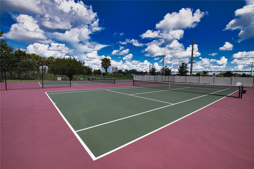 674 El Tango North Port, FL 34287 - Photo 82 of 85 a view of an outdoor space and tennis court